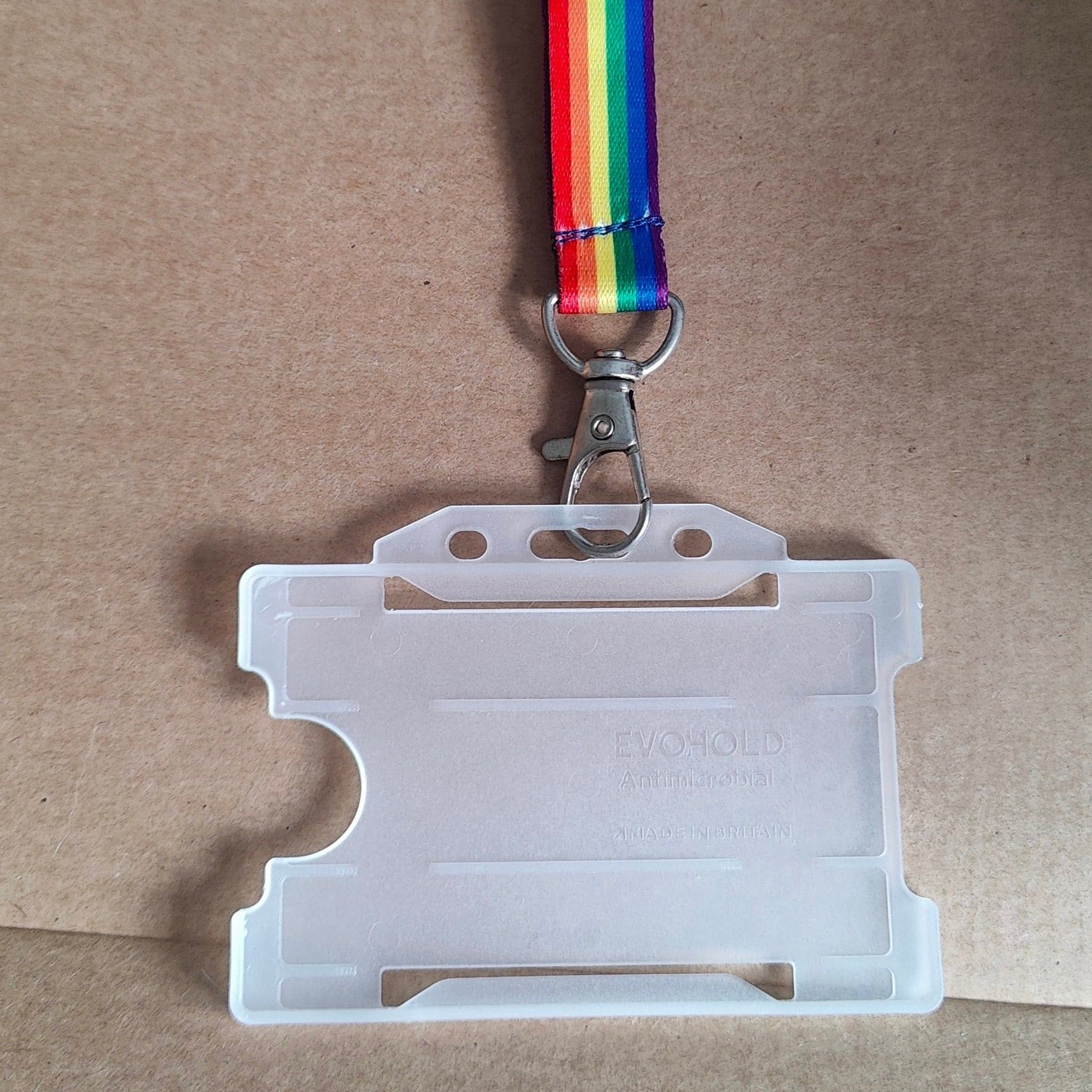 Plastic card holder on gay pride lanyard