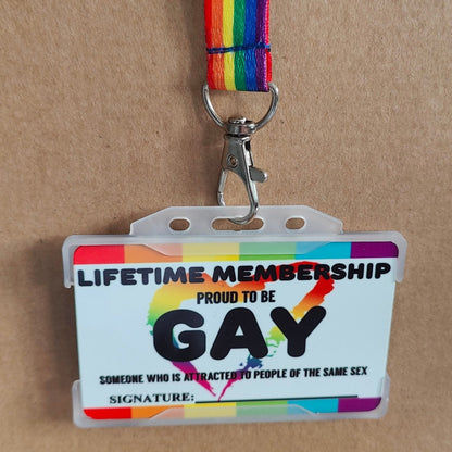 Gay membership card hanging on a gay pride lanyard