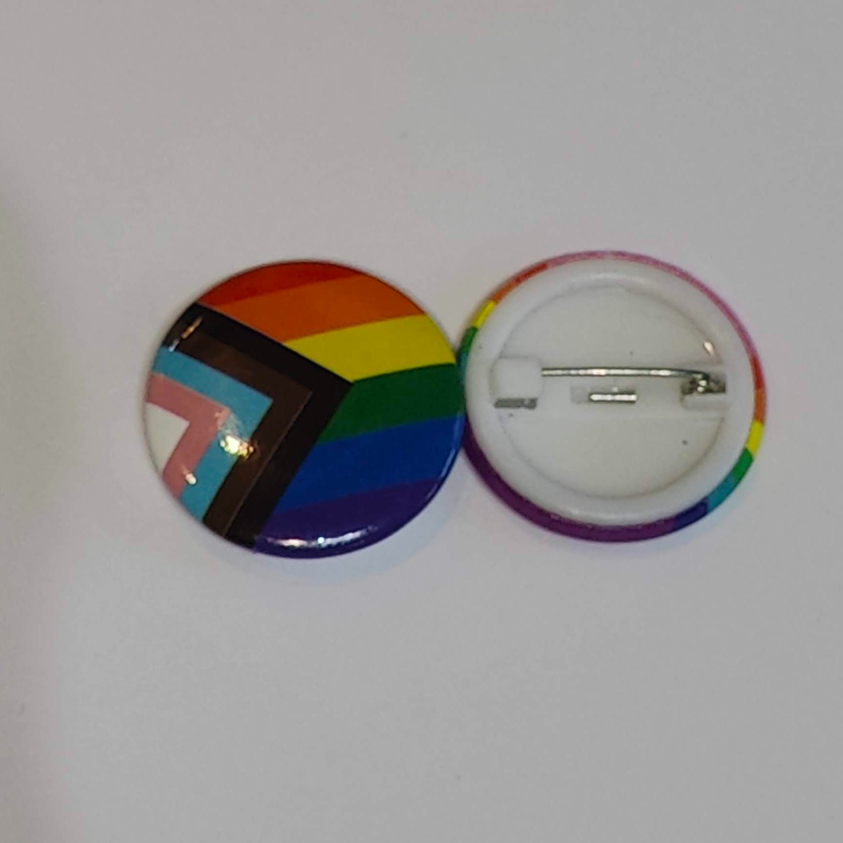 Progress pride badge front and back