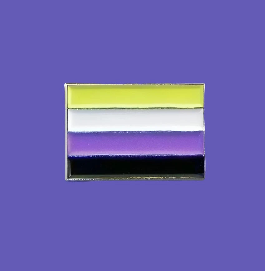 non-binary enamel badge on purple background